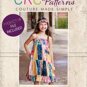 May include: A girl wearing a colorful patchwork dress with a floral print. The dress has a ruffled hem and a pocket on the front. The girl is wearing a headband with flowers. The image includes the text "CKC Patterns Couture Made Simple" and "PROJECTOR FILE INCLUDED".