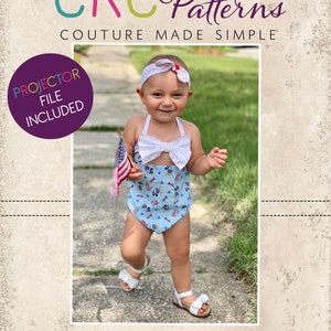 May include: A baby wearing a light blue swimsuit with a Mickey Mouse print, white bow, and matching headband. The baby is holding a small American flag and wearing white sandals. The image includes the text "CKC Patterns" and "CKC Babies".