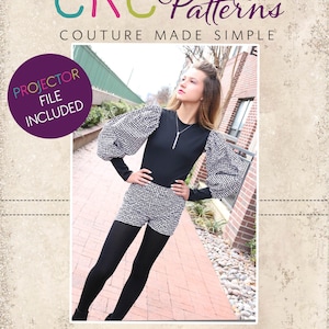 May include: A girl wearing a black and white checkered top with puffed sleeves and black shorts. She is standing on a brick walkway. The image includes the text "CKC Patterns Couture Made Simple" and "CKC Kids".