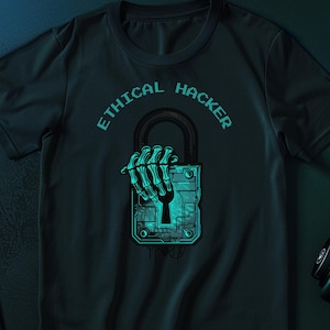 May include: A dark charcoal crew neck t-shirt featuring a cyan graphic of a skeletal hand gripping a padlock. The text "ETHICAL HACKER" is printed in a pixelated cyan font above the padlock, which displays a digital circuit board pattern.