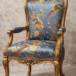 May include: An ornate armchair with a gold-colored frame and legs. The chair's back and seat are upholstered in a blue fabric with a gold floral and bird pattern. The chair has curved armrests and decorative carvings.