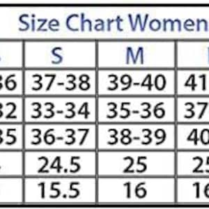 May include: A size chart for women's clothing, with measurements in inches. The chart includes sizes from XXS to XXXL, detailing bust, waist, hips, sleeve, and shoulder measurements for each size. The text "Size Chart Women" is at the top.