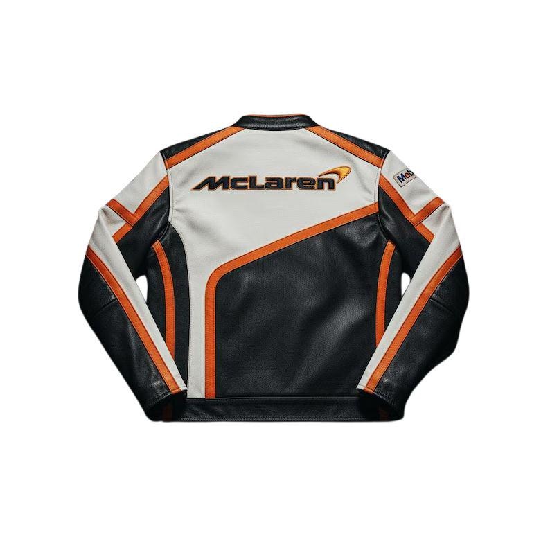May include: Black, white, and orange McLaren racing jacket. The jacket features the McLaren logo on the back and orange stripes on the sleeves and sides. The jacket is made of leather and has a classic racing design.