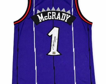Camiseta autografiada a mano de Tracy McGrady de los Raptors con certificado de autenticidad.