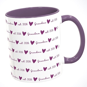 May include: White ceramic mug with a purple interior and handle. The mug is decorated with repeating purple hearts and the words "Grandma est. 2026". A gift for a new grandmother.