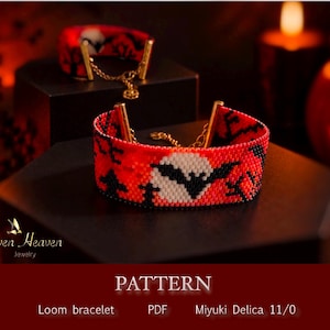 Puede incluir: Dos pulseras de cuentas tejidas con fondo rojo, una silueta de murciélago negra y un diseño de luna llena blanca. Las pulseras incluyen terminales de metal dorado y una delicada cadena de cierre. El texto Seven Heaven Jewelry es visible.