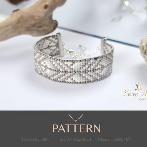 May include: A silver and white beaded loom bracelet with a geometric design. The bracelet is displayed on a white surface. The text "PATTERN" is visible. The bracelet is made with Miyuki Delica 11/0 beads.