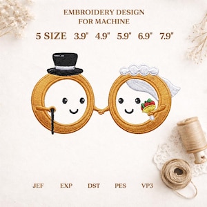 May include: Embroidered design for machine embroidery. Features a gold ring design with a bride and groom, each with a smiling face. The groom wears a top hat and holds a cane. The bride holds a bouquet. Available in 5 sizes, from 3.9" to 7.9".