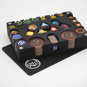 May include: Black game organiser with assorted game pieces, tokens, and cards. The organiser has multiple compartments for storage. The game pieces are in various colours, including red, blue, yellow, and green. The organiser sits on a black mat with a white logo.