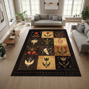 May include: A large, rectangular area rug with a black border and a repeating pattern of floral and bird motifs in squares. The squares feature various designs in shades of red, gold, green, and white, creating a vintage, folk art aesthetic.