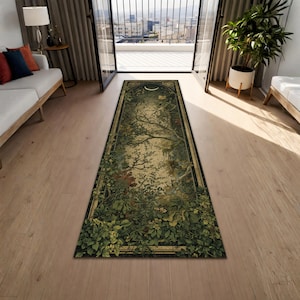 May include: A rectangular area rug with a nature-themed design. The rug features a central image of a tree with a crescent moon at the top, surrounded by lush green foliage, flowers, and a dark border. The color palette includes greens, browns, and beige.