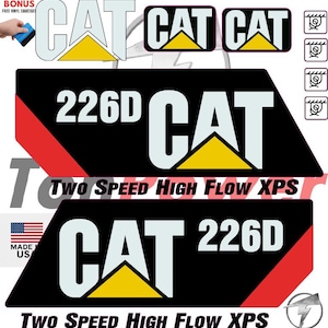 May include: A collection of CAT decals in various sizes and designs. The decals feature the CAT logo with a yellow triangle and the text "CAT" in white. Some decals include "226D" and "TWO SPEED HIGH FLOW XPS" text. Made in the USA.