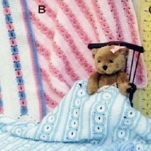 May include: Four crocheted blankets labelled A, B, C, and D. Blanket A is white with pink and blue stripes. Blanket B is pink with textured rows. Blanket C is yellow and green. Blanket D is light blue with white circular patterns, covering a teddy bear.