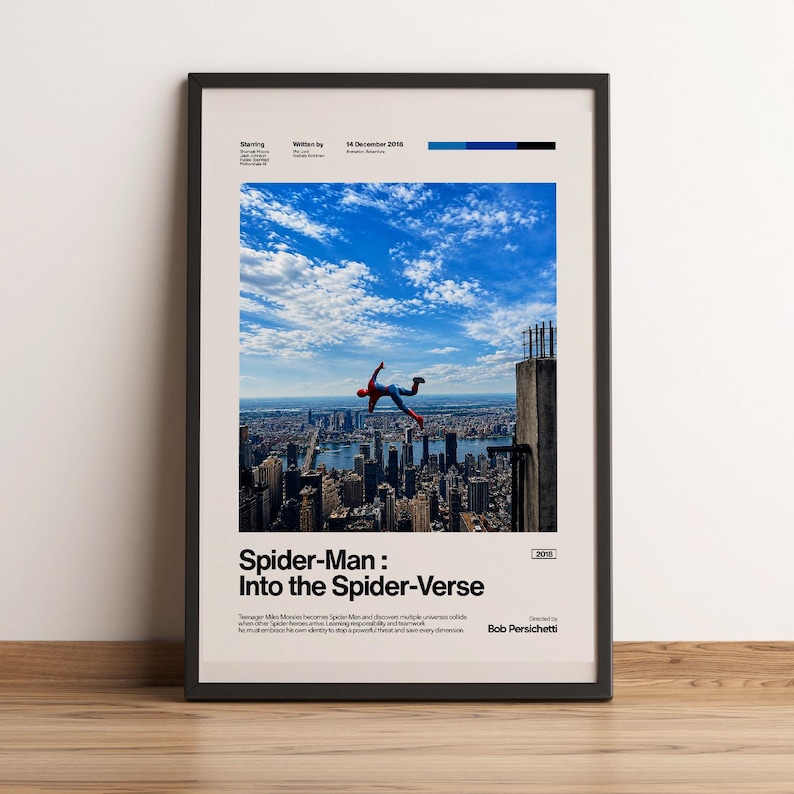 May include: Framed poster featuring a scene from "Spider-Man: Into the Spider-Verse." The image shows Spider-Man falling from a building against a backdrop of a city skyline and a blue sky with clouds. The poster includes the film's title and credits.