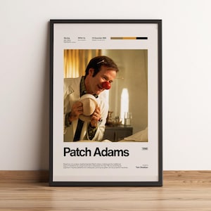 Könnte beinhalten: Ein gerahmtes Filmplakat für Patch Adams aus dem Jahr 1998. Das Plakat zeigt ein zentrales Bild einer Person im weißen Arztkittel mit roter Clownsnase, die einen Hut hält. Der Text enthält den Titel sowie Besetzungs- und Produktionsdetails.