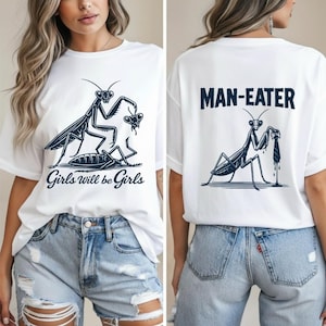 May include: White t-shirt with a black graphic of a praying mantis and the text "Girls will be Girls" on the front. The back of the shirt features a mantis graphic and the text "MAN-EATER".