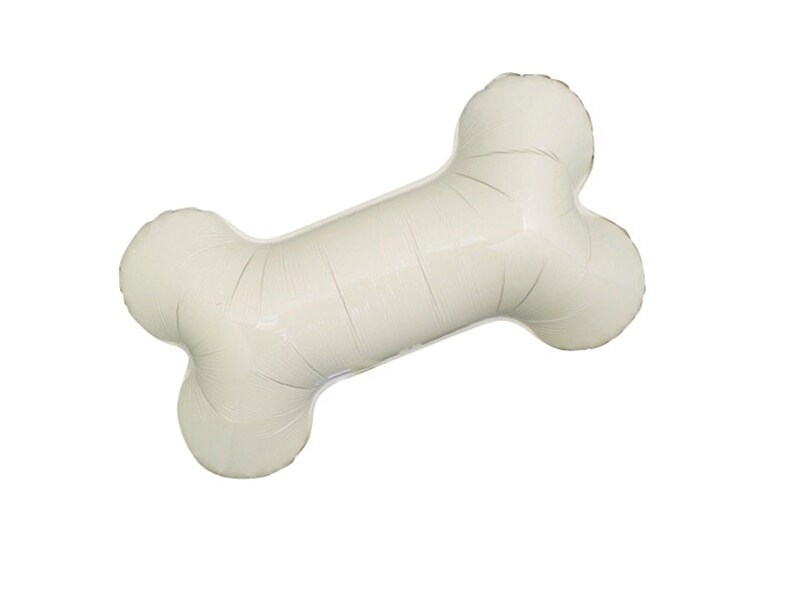 May include: A large, off-white bone-shaped balloon, inflated and ready for a party. The balloon is designed to resemble a dog bone, with rounded ends and a long, central section. Perfect for a pet-themed celebration.