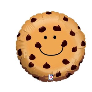 May include: A round, light brown cookie-shaped balloon with dark brown chocolate chips and a smiling face. The balloon has a metallic sheen and is suitable for a birthday party or other celebration.