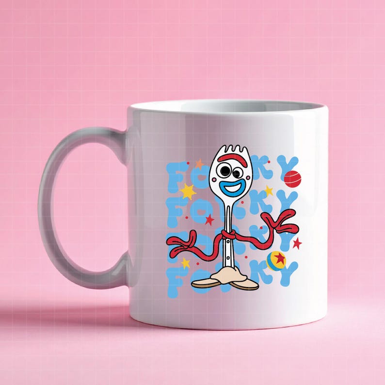 May include: White ceramic mug featuring a cartoon character design. The design includes a smiling fork with red arms and a red ribbon, along with the word "Forky" in blue and yellow. The mug has a gray handle.