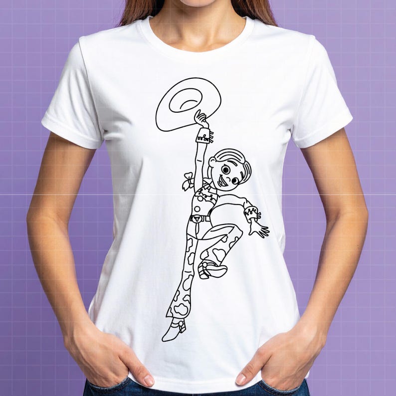 May include: White t-shirt featuring a black and white line drawing of a cartoon cowgirl holding a hat. The cowgirl is wearing a cow-print outfit and a hat. The design is centered on the front of the shirt.
