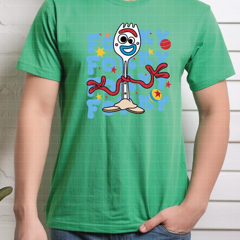 May include: Green t-shirt featuring a cartoon character Forky from Toy Story. The design includes Forky's face, red arms, and the text "Forky" in blue letters. The shirt has a crew neck and short sleeves.
