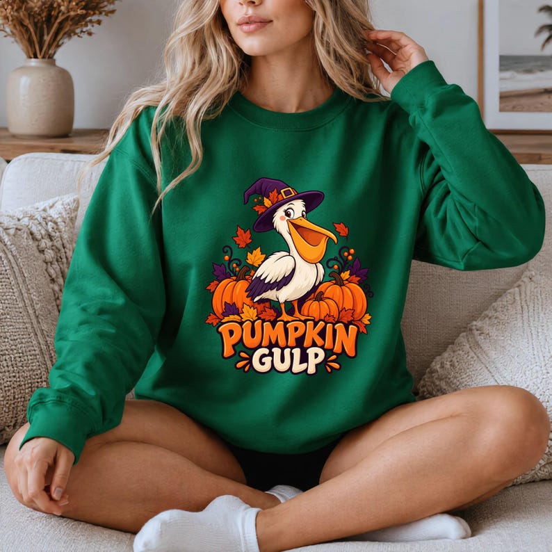 A whimsical illustration of a pelican wearing a purple witch hat, surrounded by orange pumpkins and autumn leaves, with the text PUMPKIN GULP in bold glossy orange letters.