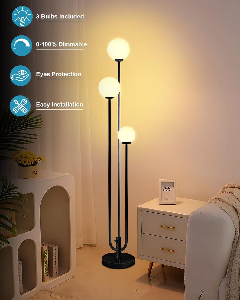 May include: A black floor lamp with three spherical, white light bulbs. The lamp has a sleek, modern design with a round base and a curved support structure. The image also shows text that says "3 Bulbs Included", "0-100% Dimmable", "Eyes Protection", and "Easy Installation".