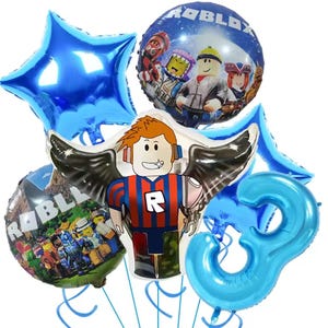 May include: A collection of blue foil balloons, including a star, a number 3, and two round balloons featuring Roblox characters and logos. The central balloon is shaped like a Roblox character with wings. Perfect for a birthday party.