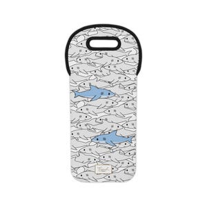 May include: A neoprene wine bottle tote featuring a repeating pattern of gray sharks with two blue sharks. The tote has a black handle and trim. The brand name is printed in gold at the bottom.