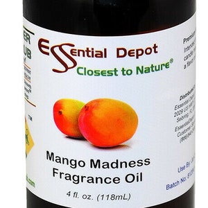 May include: A dark brown glass bottle with a black lid, labeled "Essential Depot Closest to Nature" and "Mango Madness Fragrance Oil". The bottle contains 4 fluid ounces (118 ml) of fragrance oil. Two mango slices are pictured on the label.