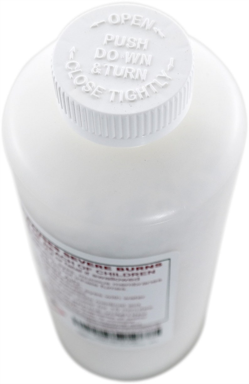 May include: White plastic bottle with a white child-resistant cap. The cap has the instructions "OPEN PUSH DOWN & TURN CLOSE TIGHTLY" printed on it. The bottle has a label that reads "FOR SEVERE BURNS KEEP OUT OF REACH OF CHILDREN".