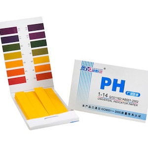May include: A white box with a blue label that reads "PH 1-14 0/3211821AB001-2002 UNIVERSAL INDICATOR PAPER" and "本产品已通过IS09001-2000质量体系认证". The box contains a pack of yellow pH test strips.