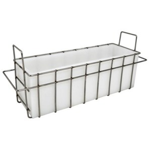 May include: A white rectangular soap mold with a metal wire frame. The frame has a handle on one side.