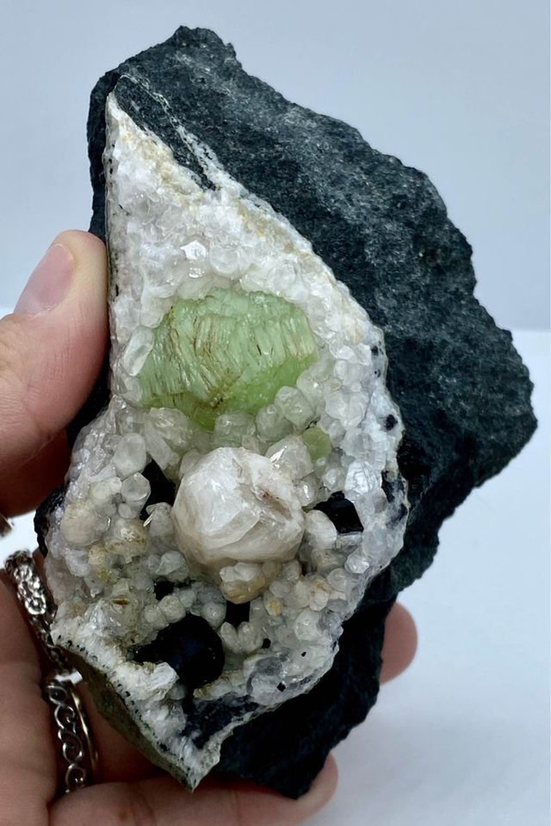 Babingtonite Crystals and Calcite Crystals on the Matrix Prehnite Botryoidal Crystal