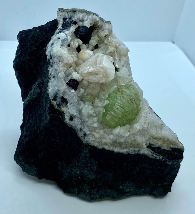 Babingtonite Crystals and Calcite Crystals on the Matrix Prehnite Botryoidal Crystal