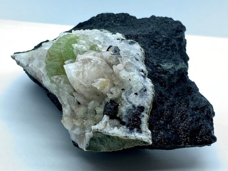Babingtonite Crystals and Calcite Crystals on the Matrix Prehnite Botryoidal Crystal