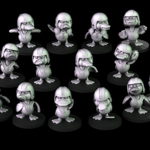 May include: A collection of gray duck figurines, each wearing a helmet and a vest. The ducks are on small, round black bases, and they are posed in various stances, with some appearing to be angry or determined.