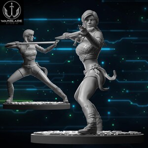 May include: Two gray warrior figurines in dynamic poses, one holding a blade and the other a staff. The figures are on circular bases, with the "WARLADE STUDIO" logo in the upper left corner. The background has a digital circuit design.