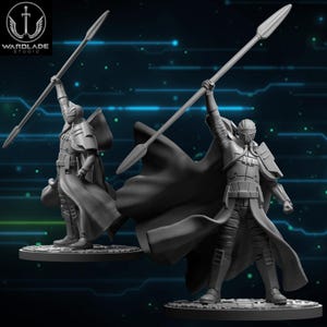 May include: Two grey miniature figures of a warrior holding a spear aloft. The figures are wearing armour and capes. The Wardlade Studio logo is in the upper left corner. The background has a blue and green digital design.