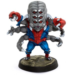 May include: A miniature figurine of a multi-eyed, multi-armed creature. The figure has a gray head with multiple red eyes, gray arms, and red and blue clothing. It stands on a dark brown circular base. The creature has sharp claws.