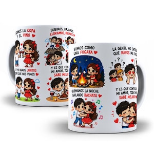 May include: A white ceramic mug featuring cartoon illustrations of a couple in various romantic scenarios with Spanish text including 'Somos la copa y el vino', 'Somos como una fogata', and 'Quemamos la noche bailando bachata' alongside red hearts.