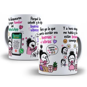 May include: A white ceramic mug featuring cartoon illustrations of a character using a smartphone, with Spanish text including 'Me bloquearon del grupo familiar del WhatsApp' and 'buenas vibras' surrounded by colourful hearts and icons.