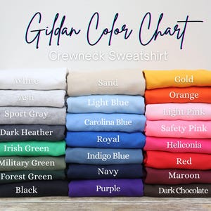 May include: A color chart for Gildan crewneck sweatshirts. The chart displays a variety of colors, including white, ash, sport gray, dark heather, Irish green, military green, forest green, black, sand, light blue, and more.