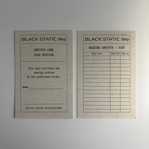 May include: Two beige archive cards from Black Static Shop. One card reads "ARCHIVE CARD 2026 EDITION" and includes a space for a name. The other card is a "READING ARCHIVE - 2026" with spaces for book titles and dates.