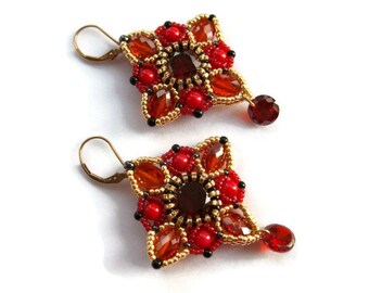 Red beaded beadwoven dangling drop earrings. Earrings with red coral and Cubic Zirconia beads.