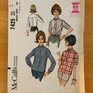 May include: A vintage McCall's sewing pattern for a misses' shirt. The pattern is for sizes 12, 32 bust, and 50c. The pattern shows three different styles of shirts, all with a button-down front and long or short sleeves.