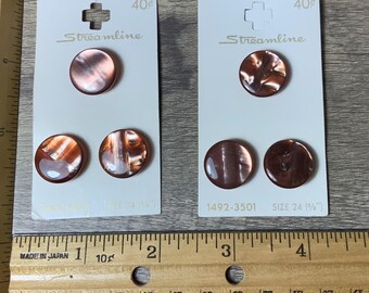 May include: Two cards with four brown buttons with a marbled pattern. The cards are labelled "Streamline" and have a price of 40 pence. The buttons are size 24 (1/4 inch).