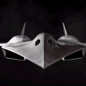 May include: A grayscale rendering of a futuristic aircraft, possibly a concept jet. The design features a sleek, angular body with prominent wings and vertical stabilizers. The aircraft has a dark, matte finish, set against a black background.