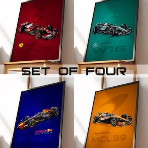 May include: A set of four framed posters featuring Formula 1 race cars. The posters display a red Ferrari SF-25, a teal Mercedes-AMG Petronas W16, a blue Red Bull Racing RB21, and an orange McLaren MCL39, each with its respective team logo and car model.