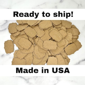 May include: A large pile of brown paper earring cards with a scalloped edge. The cards have two holes punched in the top for attaching earrings. The text "Ready to ship!" and "Made in USA" is visible in the image.